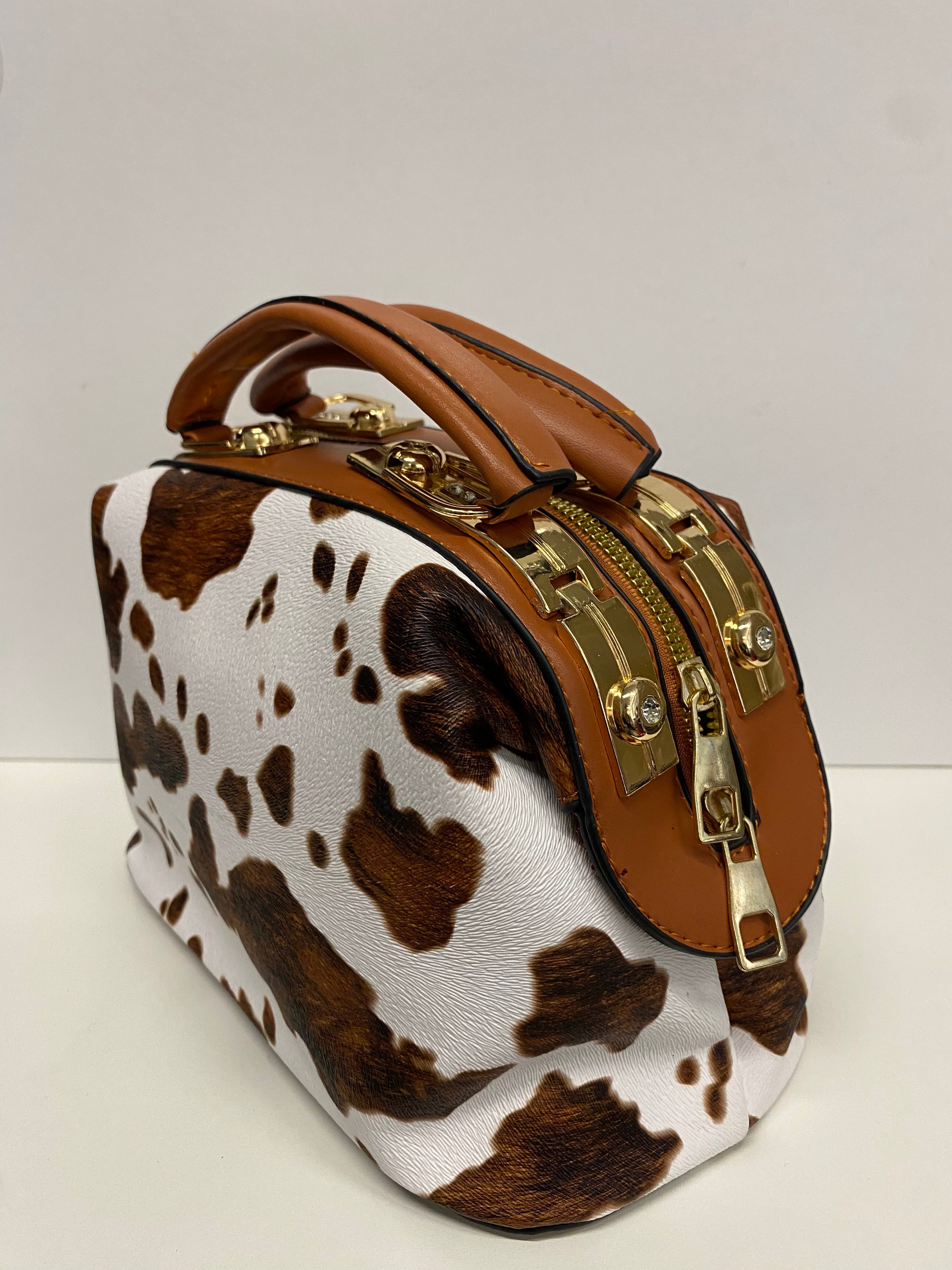 BAULETTO BIANCO E MARRONE STAMPA MUCCATO CON MANINI E TRACOLLA